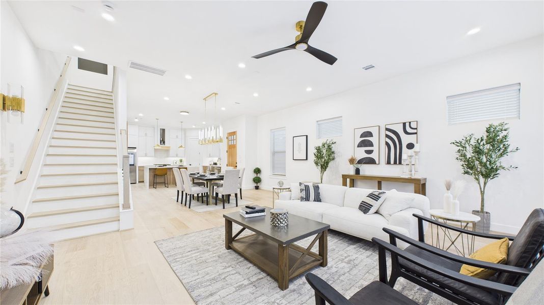 Well planned out first floor living, dining, & kitchen, showing the open concept layout