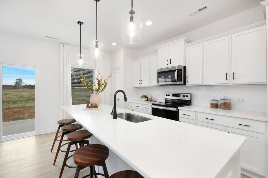 Representative furnished interior of a home built from the TA1800 by True Homes in Streamside, Red Cross (Image 3).