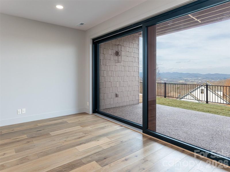 Sliding Glass doors to Terrace Patio and back yard with big mountain views