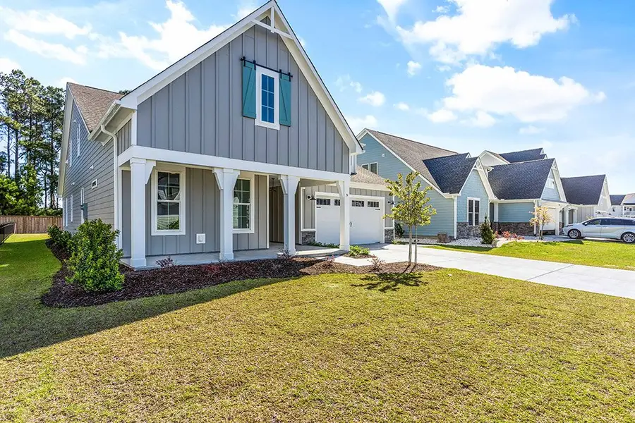 Representative exterior photo of a completed home built from the The Sutton by RobuckHomes in Windwater, Hampstead, NC (Image 2). Representative exterior photo of a completed home built from the The Sutton by RobuckHomes in Windwater, Hampstead, NC (Image 2).