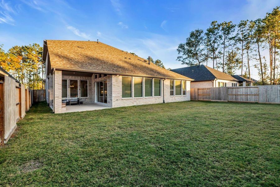 Exterior details and patio area of a home in The Highlands - 65', Porter (Image 24). Exterior details and patio area of a home in The Highlands - 65', Porter (Image 24).