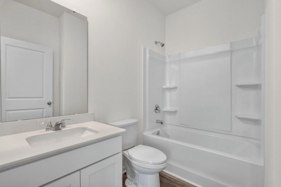 Representative furnished interior of a home built from the Europa by Starlight Homes in Oakfield Lakes, Parrish (Image 11).