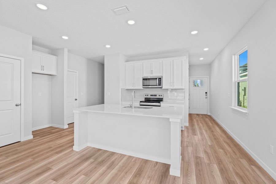 Lot 147 Kitchen with White Cabinets at Camden Woods in Kingsland
