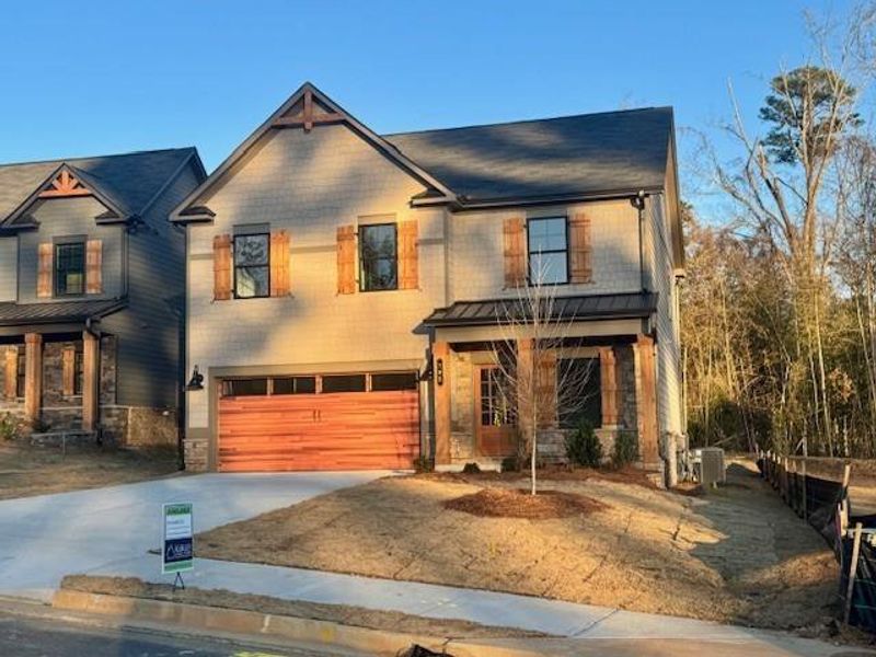 Front exterior of a new home in Meadow Pines, Dallas, GA, highlighting curb appeal (Image 17).