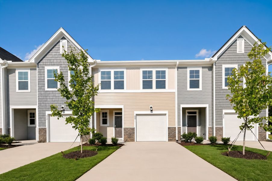 Front exterior of a new home in Myrtle Meadows Townes, Angier, NC, highlighting curb appeal (Image 1). Front exterior of a new home in Myrtle Meadows Townes, Angier, NC, highlighting curb appeal (Image 1).