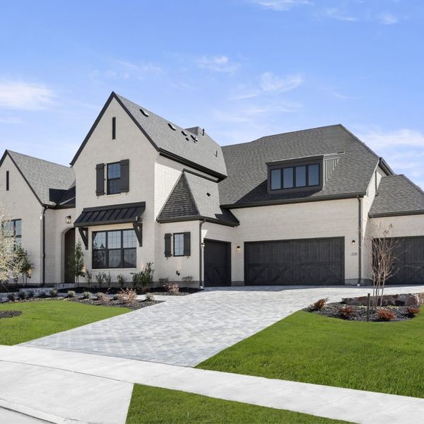 Front exterior of a new home in Mustang Lakes, Celina, TX, highlighting curb appeal (Image 30). Front exterior of a new home in Mustang Lakes, Celina, TX, highlighting curb appeal (Image 30).