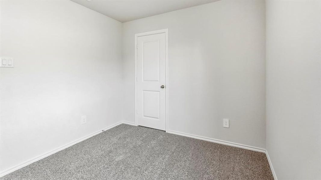 Spare room featuring carpet and baseboards Spare room featuring carpet and baseboards