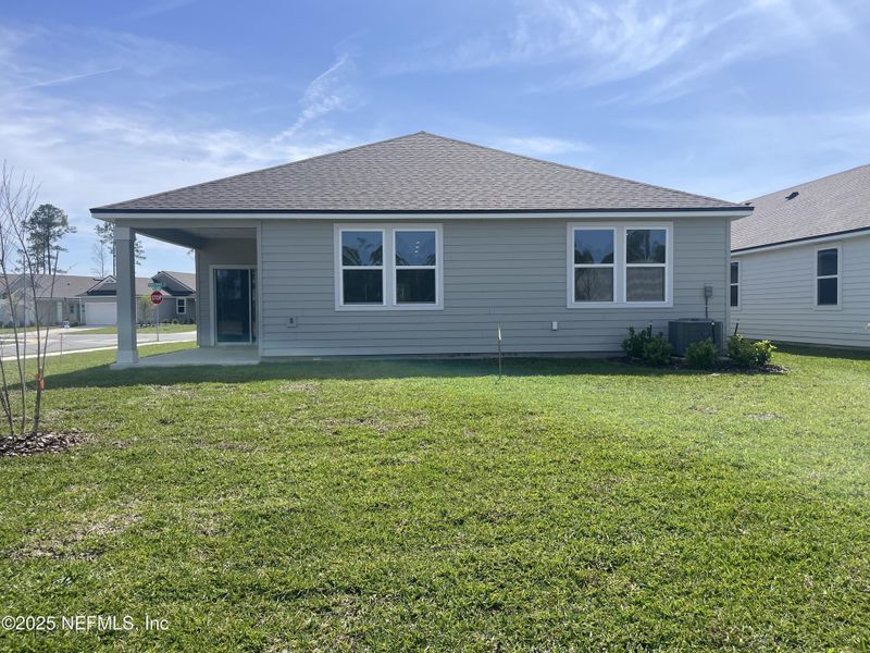 Exterior details and patio area of a home in Magnolia Series at Seminole Palms, Palm Coast (Image 3).