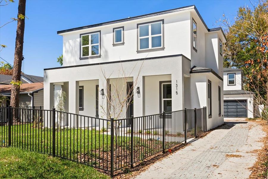 Front exterior of a new home in , Orlando, FL, highlighting curb appeal (Image 22).