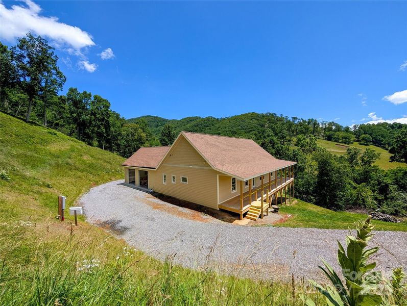 Front exterior of a new home in , Burnsville, NC, highlighting curb appeal (Image 8). Front exterior of a new home in , Burnsville, NC, highlighting curb appeal (Image 8).