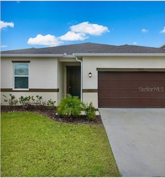 Front exterior of a new home in , Davenport, FL, highlighting curb appeal (Image 18).