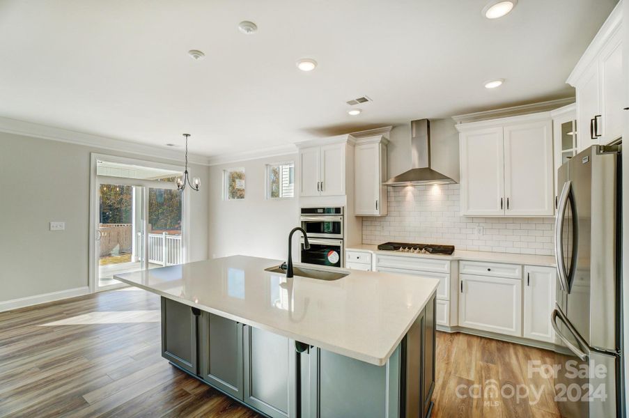 This home features all white cabinets and island