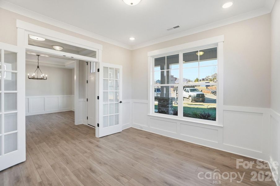 Office with wainscoting & French doors