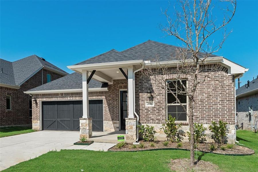 Front exterior of a new home in Arbors at Legacy Hills, Celina, TX, highlighting curb appeal (Image 14). Front exterior of a new home in Arbors at Legacy Hills, Celina, TX, highlighting curb appeal (Image 14).