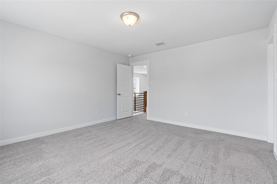 Empty room featuring carpet floors and baseboards Empty room featuring carpet floors and baseboards