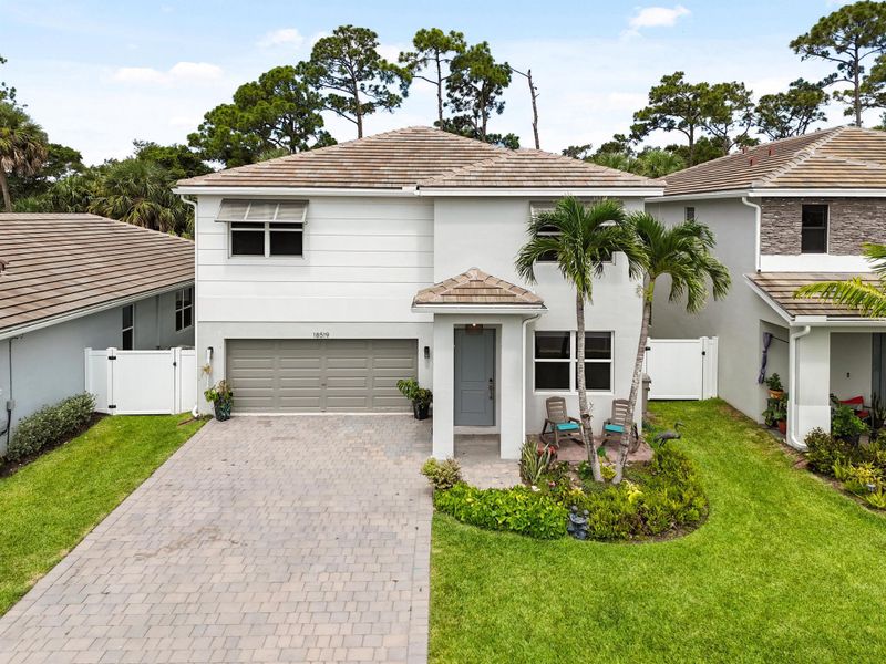 Front exterior of a new home in Reserve at Jupiter, Jupiter, FL, highlighting curb appeal (Image 33).