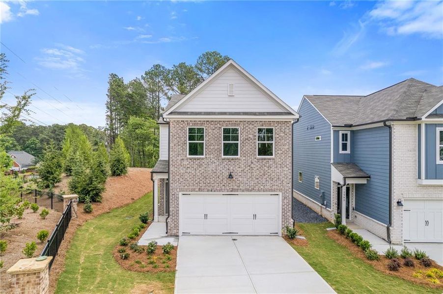 Front exterior of a new home in , Dacula, GA, highlighting curb appeal (Image 25). Front exterior of a new home in , Dacula, GA, highlighting curb appeal (Image 25).