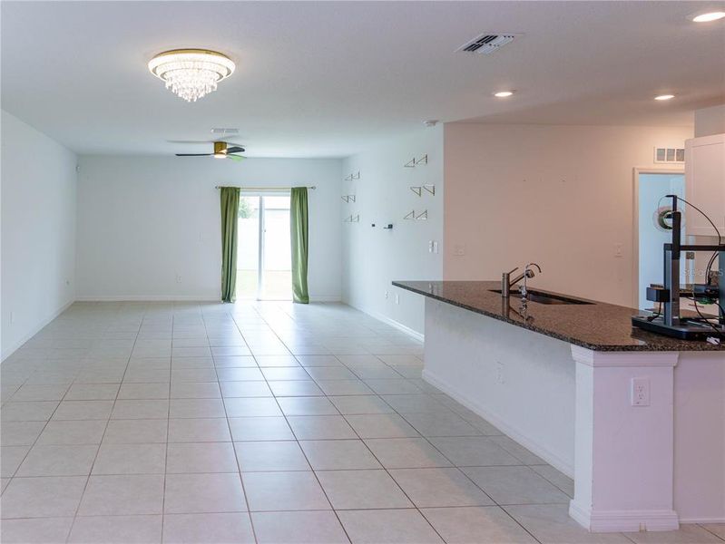 Furnished interior view inside a new home in The Isle of Avalon, Spring Hill (Image 4).