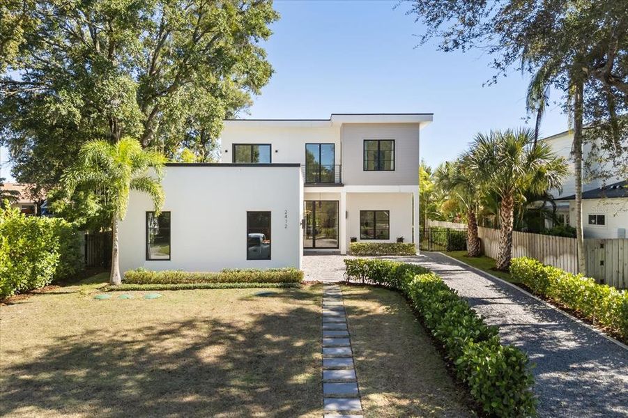 Front exterior of a new home in , Winter Park, FL, highlighting curb appeal (Image 26). Front exterior of a new home in , Winter Park, FL, highlighting curb appeal (Image 26).