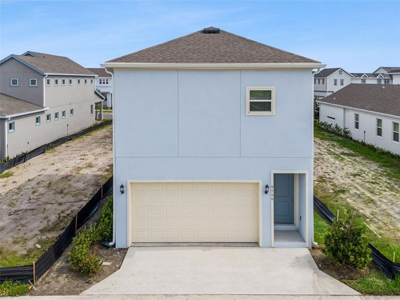 Front exterior of a new home in Laureate Park, Orlando, FL, highlighting curb appeal (Image 30).