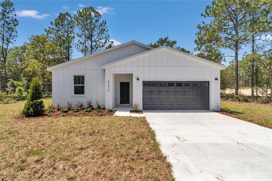 Front exterior of a new home in , Dunnellon, FL, highlighting curb appeal (Image 25). Front exterior of a new home in , Dunnellon, FL, highlighting curb appeal (Image 25).