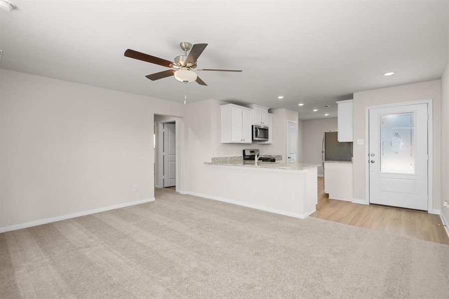 Open concept living room flows right to your kitchen.