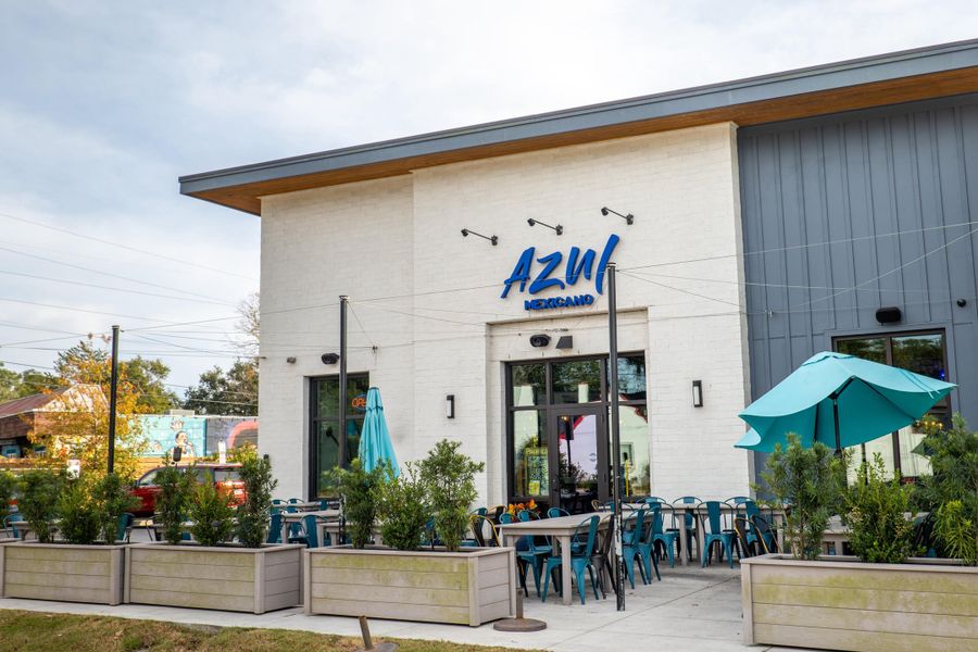 Front exterior of a new home in Indigo Grove Single Family Homes, Johns Island, SC, highlighting curb appeal (Image 1).
