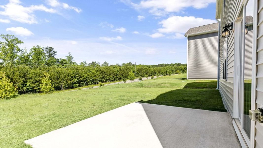 Exterior details and patio area of a home in The Grove at Matthews Landing, Fuquay Varina (Image 23).
