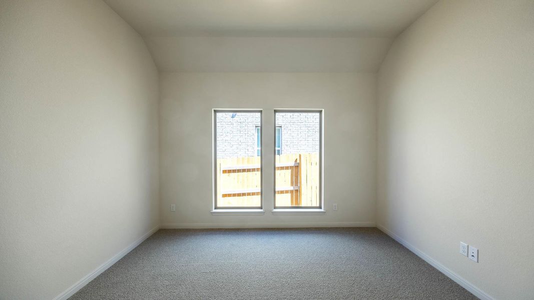 Spare room featuring carpet flooring and baseboards Spare room featuring carpet flooring and baseboards