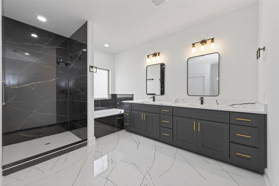 Spa-inspired primary bath with double-sink vanity, soaking tub, walk-in shower, and modern finishes.