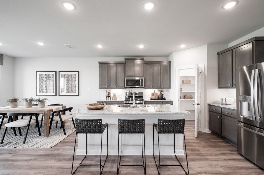 Representative furnished interior of a home built from the Yellowstar by Tri Pointe Homes in Mason Woods, Cypress (Image 6).