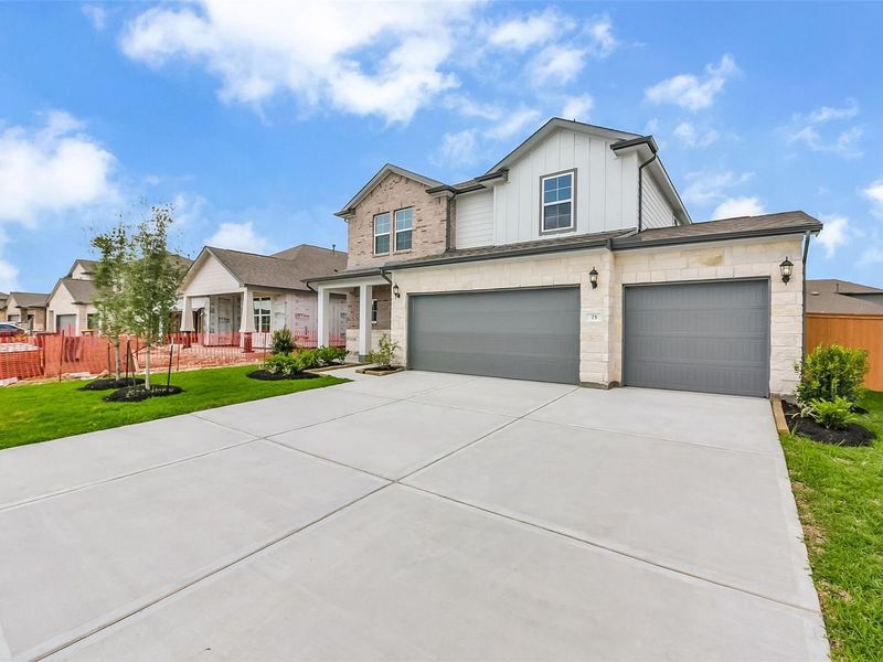 Front exterior of a new home in River Ranch Meadows, Dayton, TX, highlighting curb appeal (Image 21).