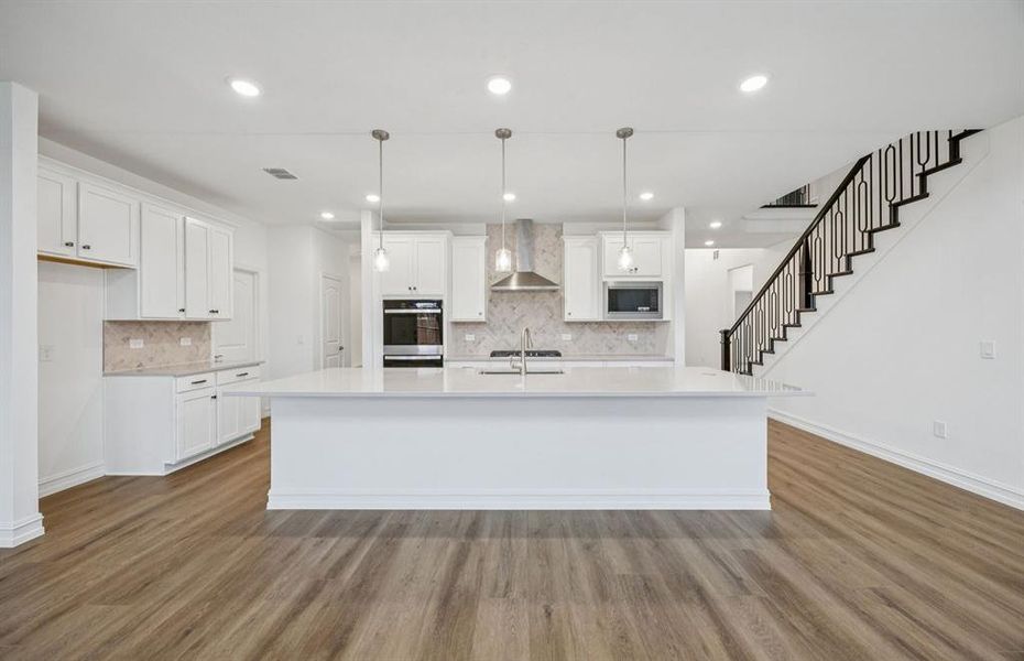Spacious kitchen with eat-in bar top island