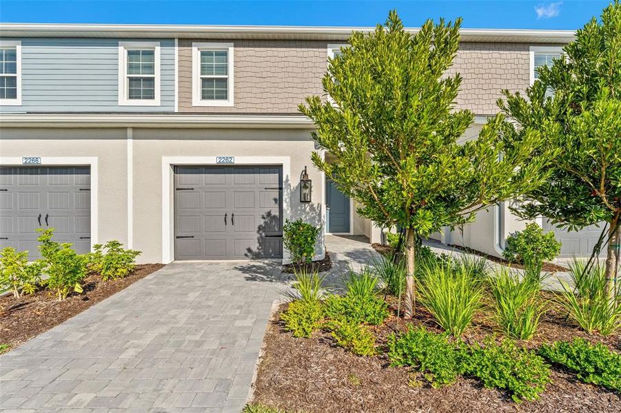 Front exterior of a new home in , Bradenton, FL, highlighting curb appeal (Image 22).