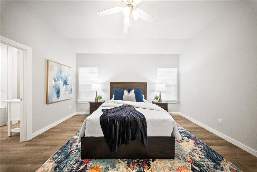 Bedroom with wood finished floors and a ceiling fan Bedroom with wood finished floors and a ceiling fan