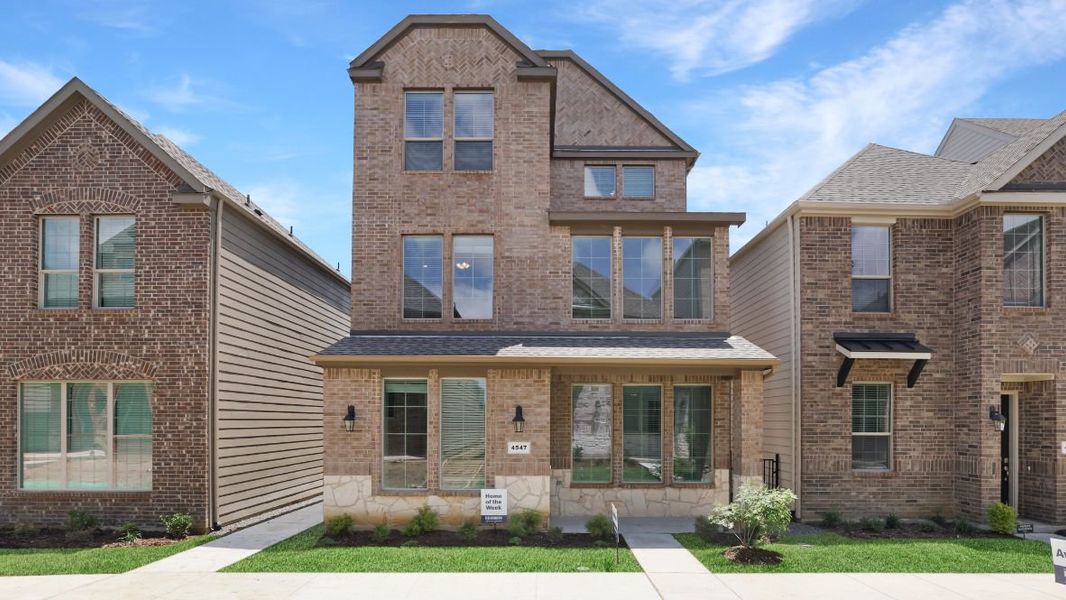 Front exterior of a new home in The Avenue, Allen, TX, highlighting curb appeal (Image 2). Front exterior of a new home in The Avenue, Allen, TX, highlighting curb appeal (Image 2).