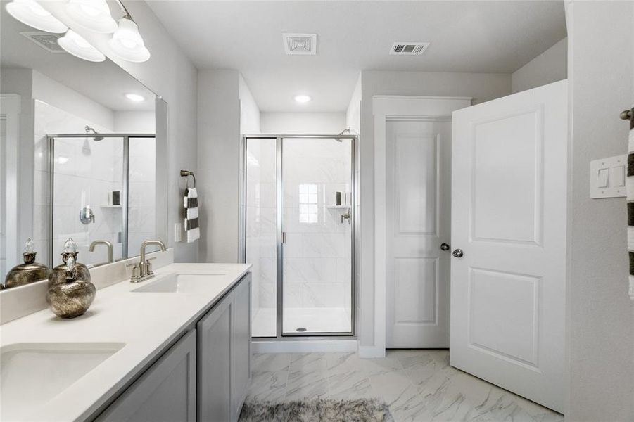 Bathroom with vanity and walk in shower