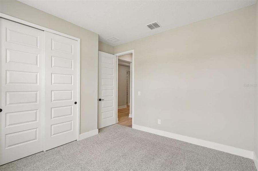 Spacious, unfurnished interior of a new home in Legends Preserve - Signature Series, Daytona Beach (Image 21).