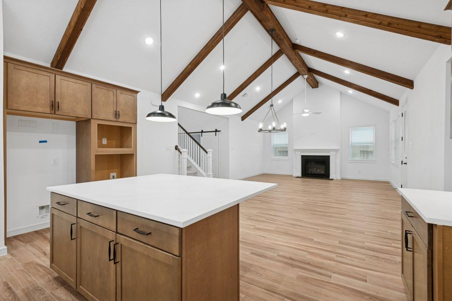 Kitchen overlooks dining area and great room