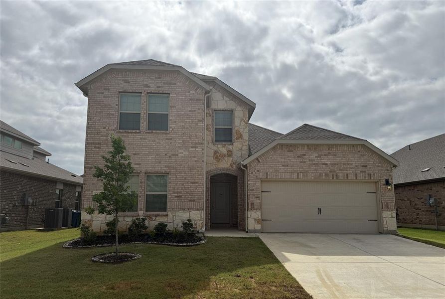 Front exterior of a new home in , Aubrey, TX, highlighting curb appeal (Image 1). Front exterior of a new home in , Aubrey, TX, highlighting curb appeal (Image 1).
