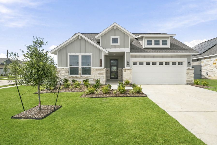 Front exterior of a new home in Fulshear Lakes, Fulshear, TX, highlighting curb appeal (Image 1). Front exterior of a new home in Fulshear Lakes, Fulshear, TX, highlighting curb appeal (Image 1).