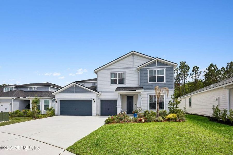 Front exterior of a new home in , Middleburg, FL, highlighting curb appeal (Image 2). Front exterior of a new home in , Middleburg, FL, highlighting curb appeal (Image 2).