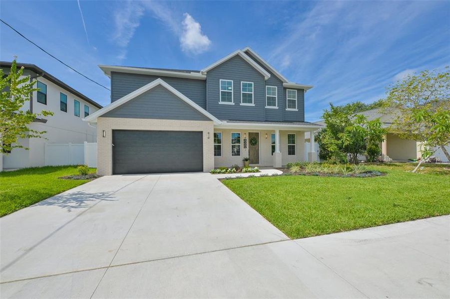 Front exterior of a new home in , Tampa, FL, highlighting curb appeal (Image 28).