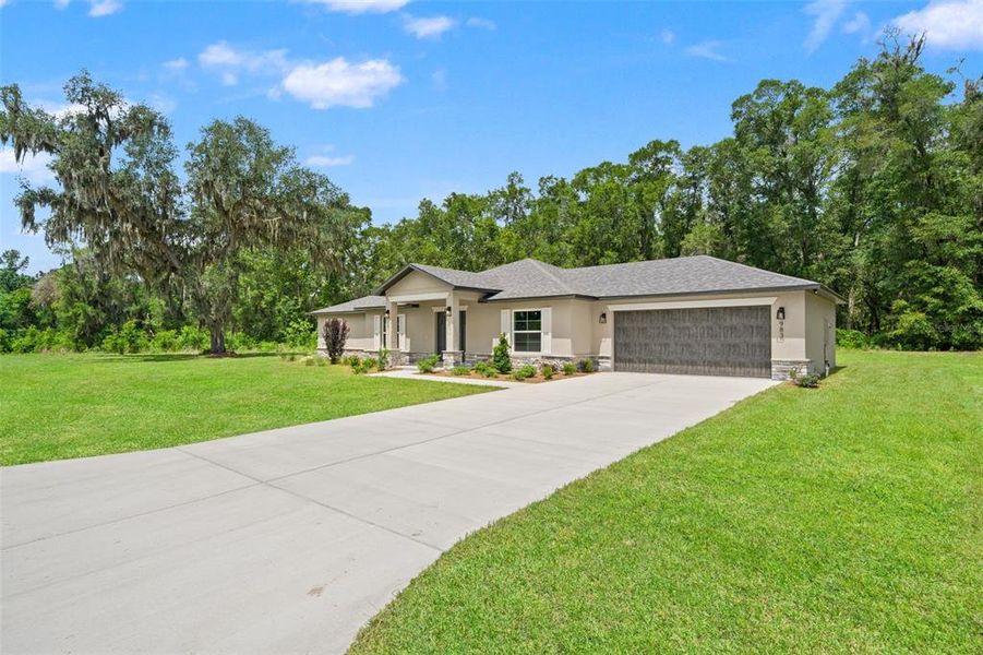 Front exterior of a new home in , Brooksville, FL, highlighting curb appeal (Image 18). Front exterior of a new home in , Brooksville, FL, highlighting curb appeal (Image 18).