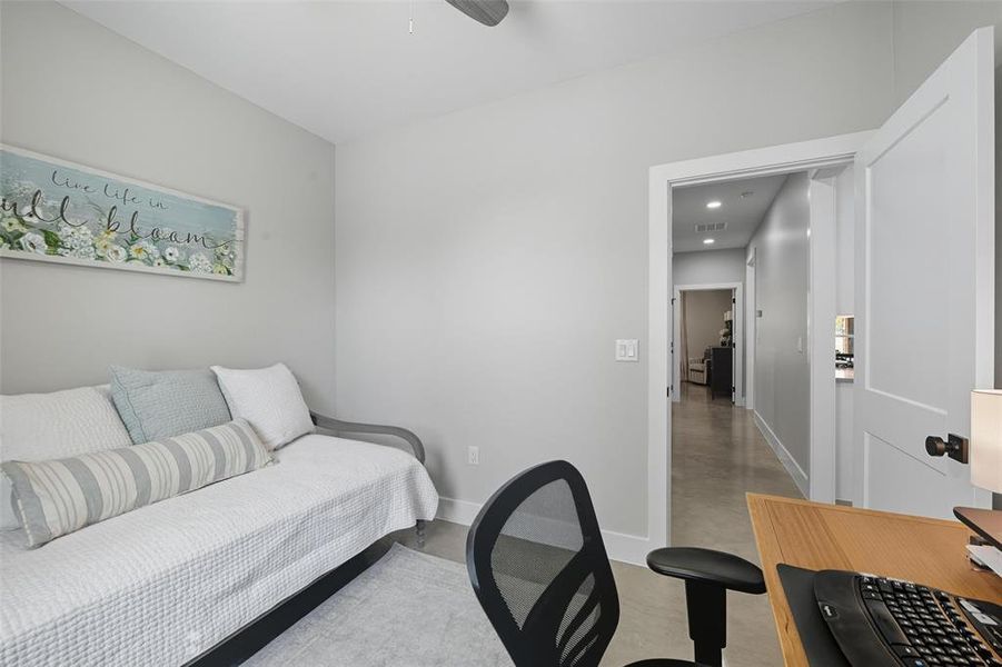 Bedroom with baseboards and ceiling fan Bedroom with baseboards and ceiling fan