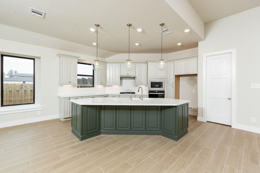 The kitchen is the beating heart of any home—it pumps life into every other room and this kitchen is no exception!