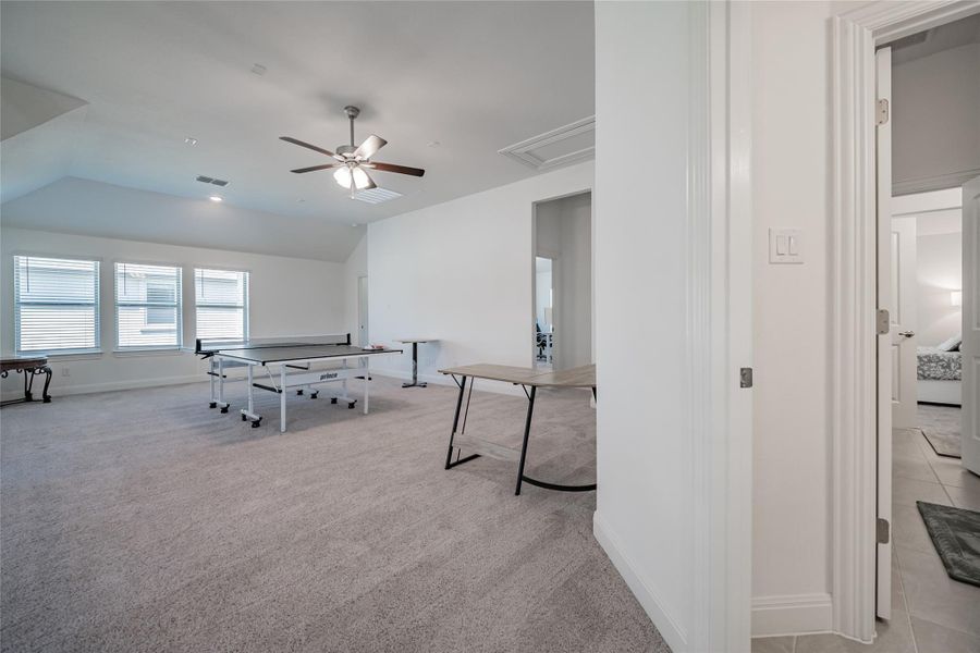 A spacious game room awaits, offering ample space for recreation and relaxation.