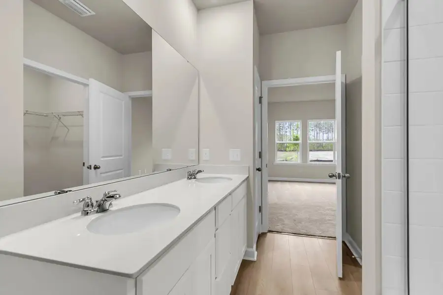 Thoughtfully designed primary bathroom with luxury finishes.