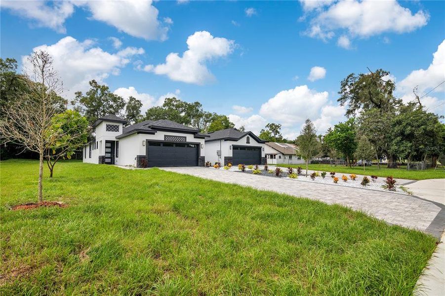 Front exterior of a new home in , Apopka, FL, highlighting curb appeal (Image 23).