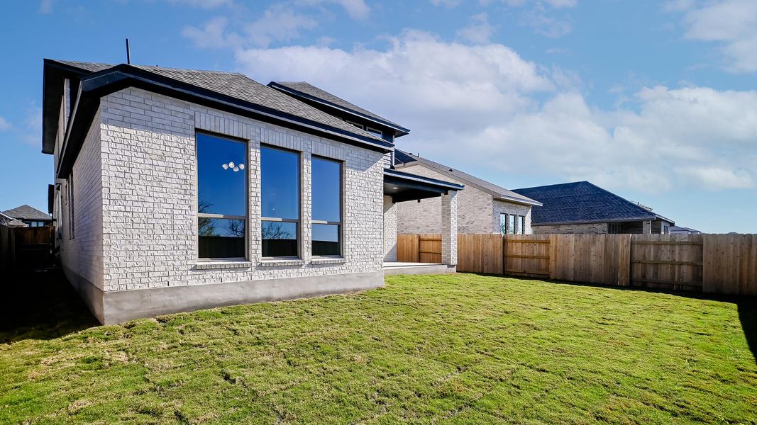 Exterior details and patio area of a home in Crosswinds 50', Kyle (Image 18).